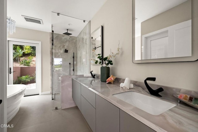 845 Rollin St, South Pasadena, CA 91030 - bathroom with a marble finish shower, double vanity, a soaking tub, and tile patterned floors
