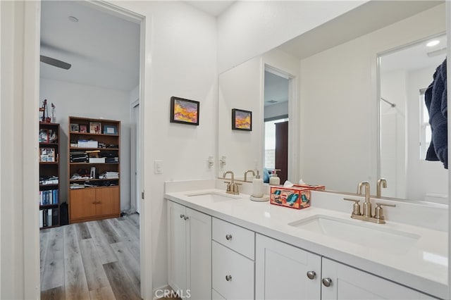 28410 Orange Park Dr, Castaic, CA 91384 - bathroom featuring double vanity and wood finished floors