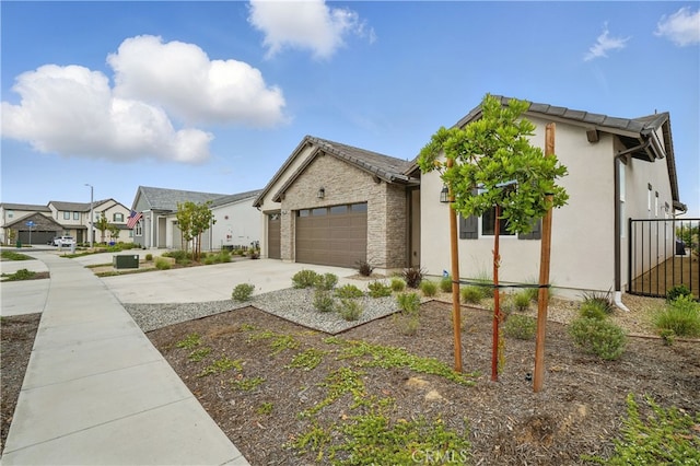 28410 Orange Park Dr, Castaic, CA 91384 - view of front of property with concrete driveway, a garage, stucco siding, and a residential view