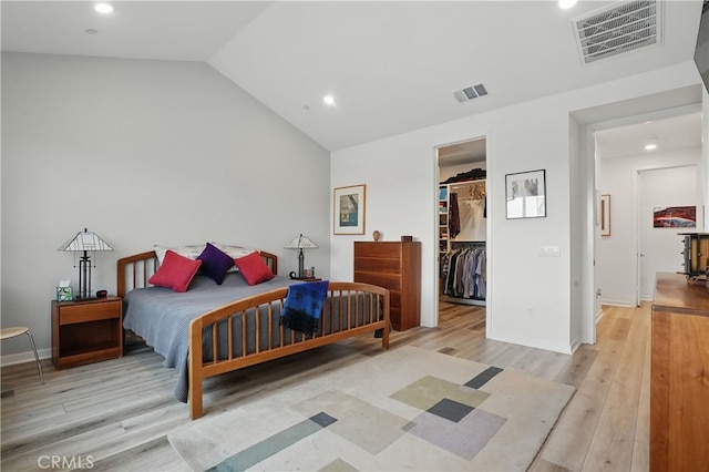 28410 Orange Park Dr, Castaic, CA 91384 - bedroom featuring wood finished floors, a spacious closet, vaulted ceiling, recessed lighting, and a closet