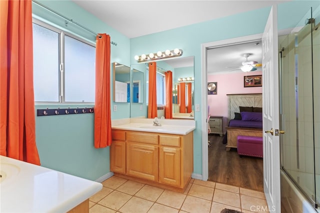 1042 Coronet Dr, Riverside, CA 92506 - ensuite bathroom with vanity, plenty of natural light, tile patterned flooring, and a ceiling fan