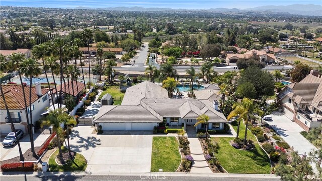 1042 Coronet Dr, Riverside, CA 92506 - aerial view of residential area featuring a mountain backdrop and a pool