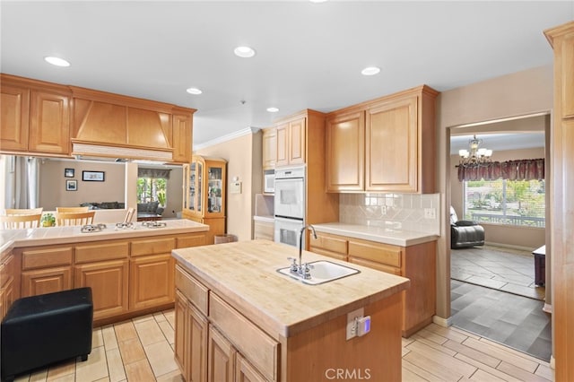 1042 Coronet Dr, Riverside, CA 92506 - kitchen with white appliances, wood counters, healthy amount of natural light, backsplash, and recessed lighting