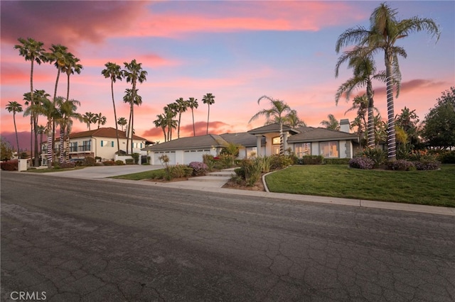 1042 Coronet Dr, Riverside, CA 92506 - ranch-style house featuring concrete driveway, an attached garage, and a yard