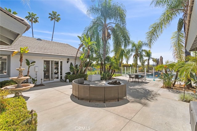 1042 Coronet Dr, Riverside, CA 92506 - view of patio with french doors and an outdoor pool