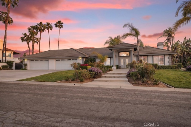 1042 Coronet Dr, Riverside, CA 92506 - ranch-style house featuring concrete driveway, stucco siding, a tiled roof, and a lawn