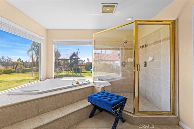 1042 Coronet Dr, Riverside, CA 92506 - full bathroom featuring a shower stall, a garden tub, and tile patterned floors