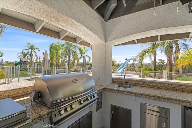 1042 Coronet Dr, Riverside, CA 92506 - view of patio featuring exterior kitchen and a sink