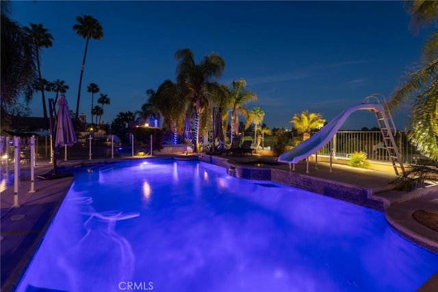 1042 Coronet Dr, Riverside, CA 92506 - pool at twilight with a water slide and an outdoor pool