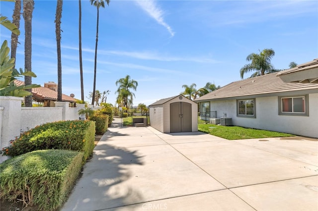 1042 Coronet Dr, Riverside, CA 92506 - view of yard with a storage unit and a patio