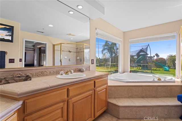 1042 Coronet Dr, Riverside, CA 92506 - bathroom featuring vanity, a stall shower, a bath, and recessed lighting