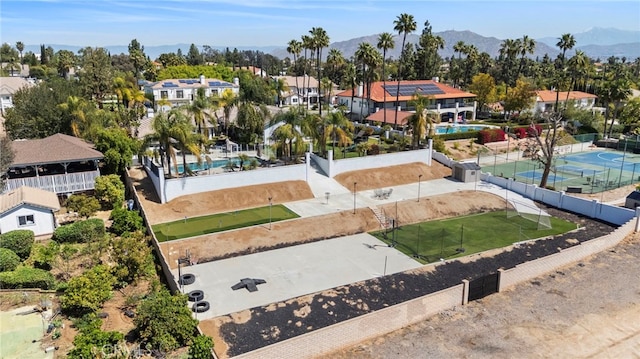 1042 Coronet Dr, Riverside, CA 92506 - aerial perspective of suburban area featuring a pool and mountains