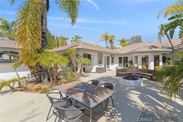 1042 Coronet Dr, Riverside, CA 92506 - view of patio with a fire pit and outdoor dining area