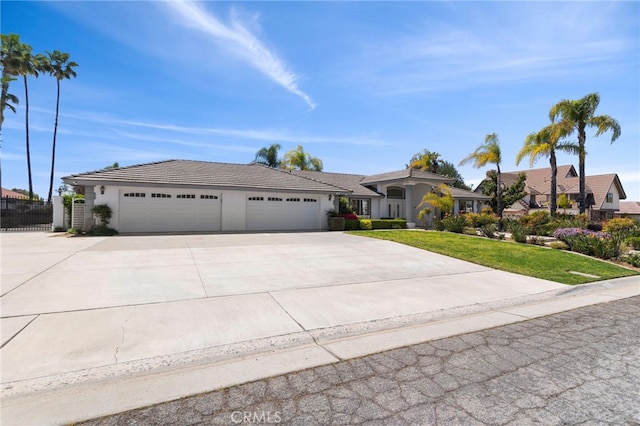 1042 Coronet Dr, Riverside, CA 92506 - ranch-style home featuring an attached garage, concrete driveway, and stucco siding