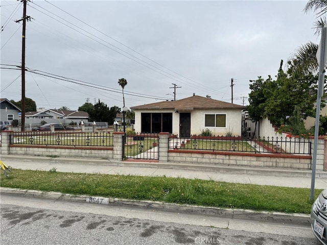 8647 Passons Blvd, Pico Rivera, CA 90660 - bungalow featuring stucco siding and a fenced front yard