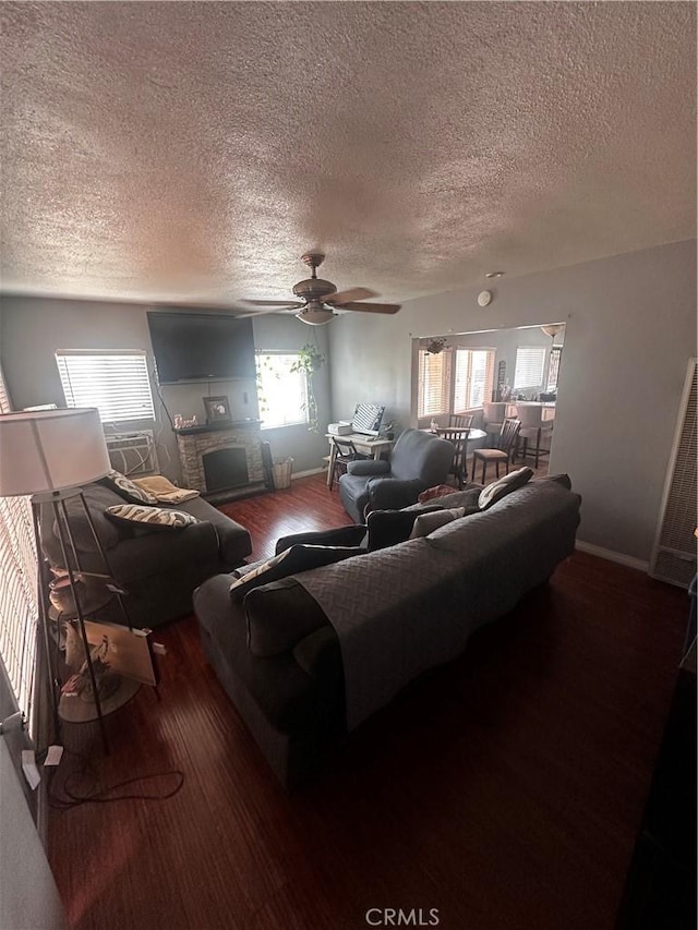 8647 Passons Blvd, Pico Rivera, CA 90660 - living room featuring wood finished floors, a textured ceiling, a ceiling fan, and healthy amount of natural light