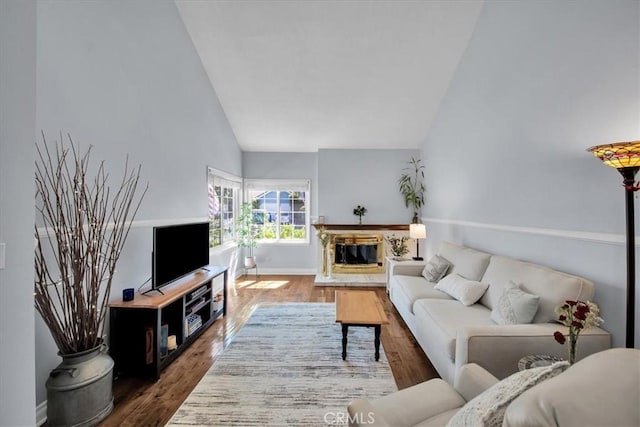 26010 Coronado Ct, Valencia, CA 91355 - living room featuring wood finished floors, high vaulted ceiling, and a glass covered fireplace