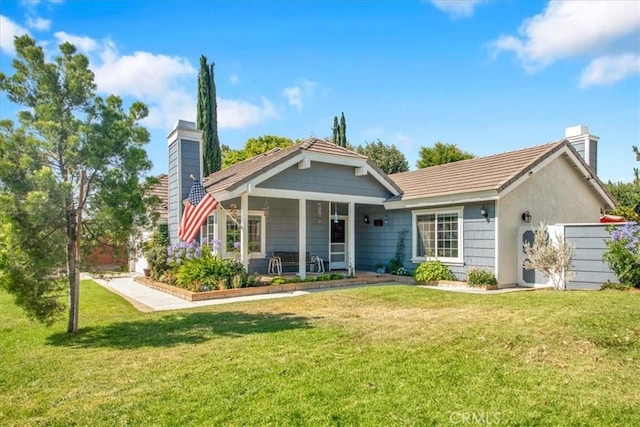 26010 Coronado Ct, Valencia, CA 91355 - rear view of house with a chimney, a yard, and covered porch