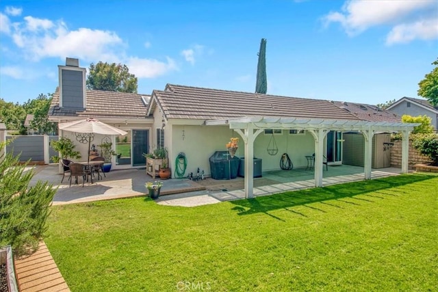 26010 Coronado Ct, Valencia, CA 91355 - rear view of property featuring a pergola, a patio area, a chimney, a tile roof, and stucco siding