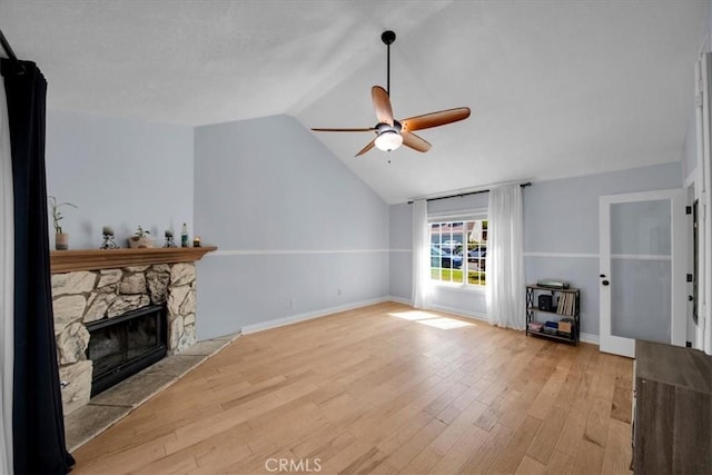 26010 Coronado Ct, Valencia, CA 91355 - unfurnished living room with ceiling fan, lofted ceiling, wood finished floors, and a stone fireplace