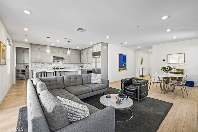 27774 Marquee Dr, Valencia, CA 91381 - living room with beverage cooler, light wood finished floors, and recessed lighting