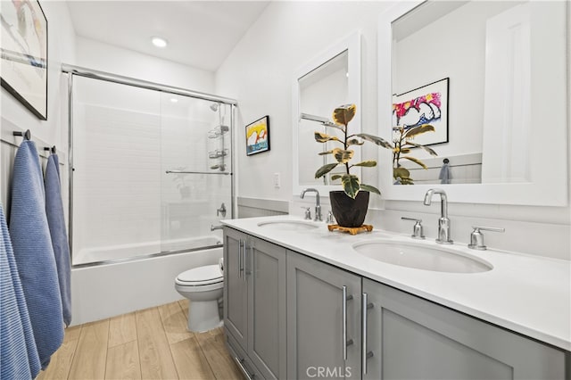 27774 Marquee Dr, Valencia, CA 91381 - full bathroom with double vanity, shower / bath combination with glass door, wood finished floors, and recessed lighting