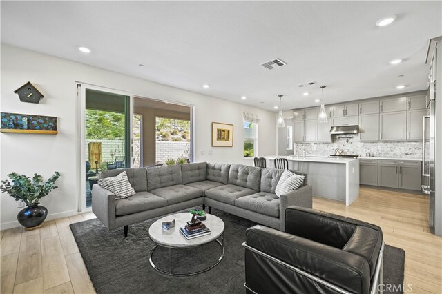 27774 Marquee Dr, Valencia, CA 91381 - living area with light wood-style floors and recessed lighting