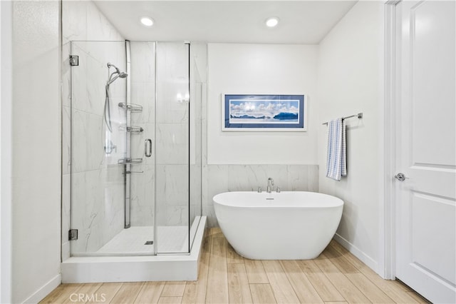 27774 Marquee Dr, Valencia, CA 91381 - bathroom featuring a stall shower, a soaking tub, wood finished floors, and recessed lighting