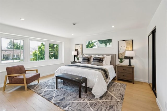 23509 Community St, West Hills, CA 91304 - bedroom featuring light wood-style floors and recessed lighting