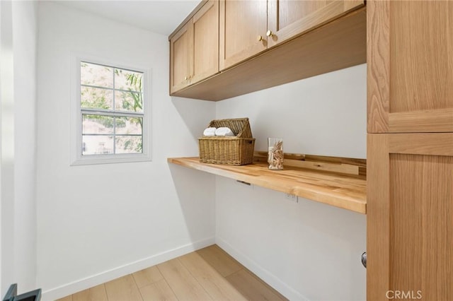 23509 Community St, West Hills, CA 91304 - laundry area featuring baseboards and light wood finished floors