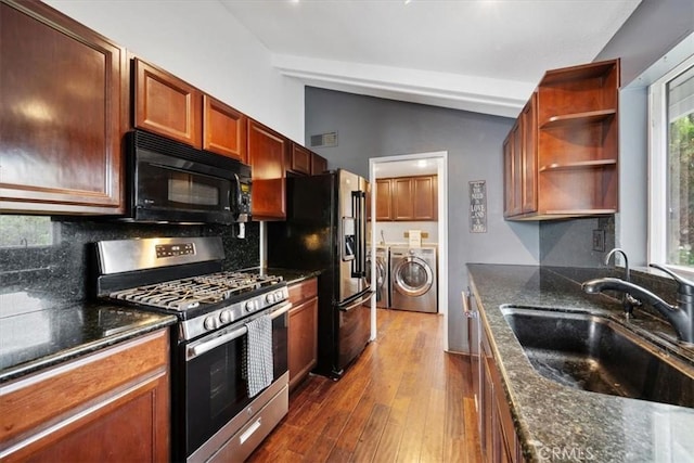 269 Los Padres Ct, Los Osos, CA 93402 - kitchen with black appliances, separate washer and dryer, vaulted ceiling, decorative backsplash, and dark wood-style floors