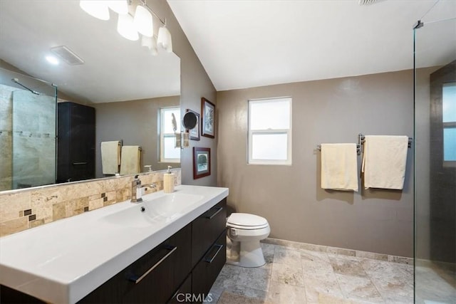 269 Los Padres Ct, Los Osos, CA 93402 - bathroom featuring vanity, a tile shower, vaulted ceiling, and backsplash