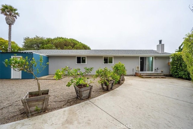269 Los Padres Ct, Los Osos, CA 93402 - back of house with a chimney and a patio area
