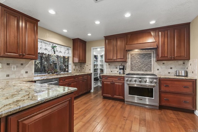 1896 Via Del Torrie, Alpine, CA 91901 - kitchen with stainless steel appliances, premium range hood, light stone counters, hardwood / wood-style floors, and tasteful backsplash