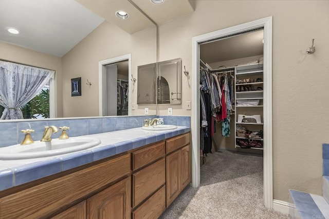 1896 Via Del Torrie, Alpine, CA 91901 - bathroom with double vanity, vaulted ceiling, and a spacious closet