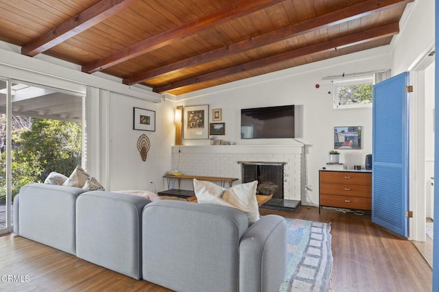 406 Santa Ana St, Ojai, CA 93023 - living area with a brick fireplace, a wooden ceiling with exposed beams, and wood finished floors