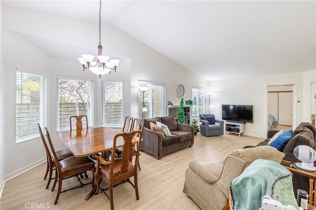 28331 Seco Canyon Rd Unit 119, Saugus, CA 91390 - dining space featuring a chandelier, vaulted ceiling, and light wood-style floors