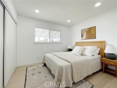 109 S San Antonio Ave, Upland, CA 91786 - bedroom with a closet, light wood-type flooring, and recessed lighting