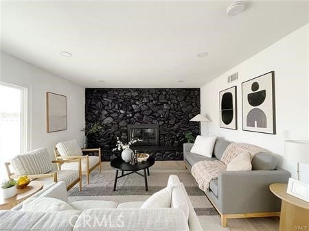 109 S San Antonio Ave, Upland, CA 91786 - living area with wood finished floors and a fireplace
