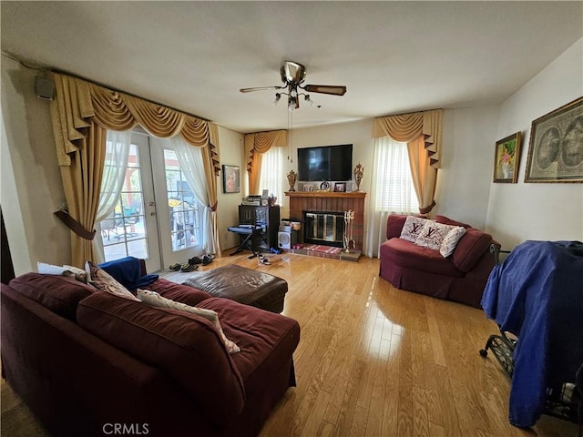 14001 Rabbit Rd, Sylmar, CA 91342 - living area featuring french doors, wood finished floors, plenty of natural light, and ceiling fan