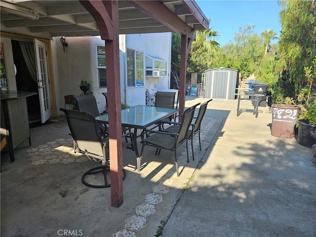 14001 Rabbit Rd, Sylmar, CA 91342 - view of patio / terrace featuring outdoor dining space and a storage shed