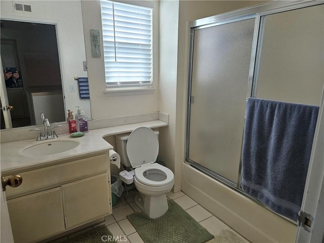 14001 Rabbit Rd, Sylmar, CA 91342 - full bath with vanity, tile patterned flooring, and bath / shower combo with glass door