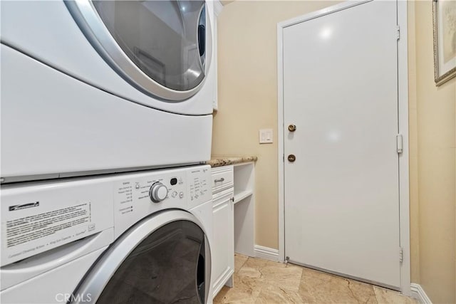 129 Five Crowns Way, Encinitas, CA 92024 - washroom with estacked washer and dryer and baseboards