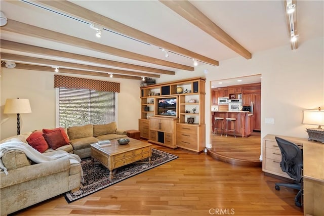 129 Five Crowns Way, Encinitas, CA 92024 - living area with light wood-style floors, a desk, track lighting, and beam ceiling