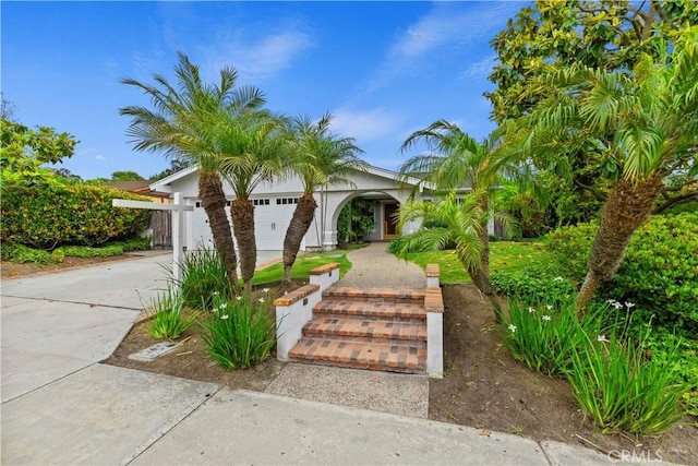 129 Five Crowns Way, Encinitas, CA 92024 - view of front of home with driveway, stucco siding, and an attached garage