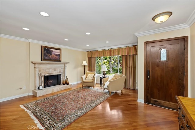 129 Five Crowns Way, Encinitas, CA 92024 - entrance foyer featuring ornamental molding, light wood-style flooring, a tile fireplace, and recessed lighting