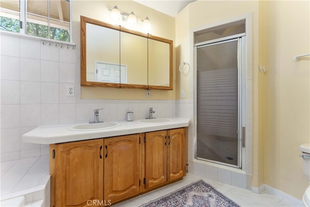 2364 6th St, La Verne, CA 91750 - bathroom featuring a stall shower, double vanity, and backsplash
