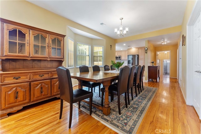 2364 6th St, La Verne, CA 91750 - dining room with a chandelier and light wood-type flooring