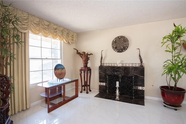 5295 Bronson Way, Riverside, CA 92506 - living area featuring a textured ceiling and baseboards