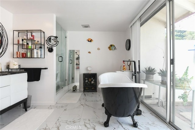 5295 Bronson Way, Riverside, CA 92506 - bathroom with vanity, a freestanding tub, a stall shower, and marble finish flooring